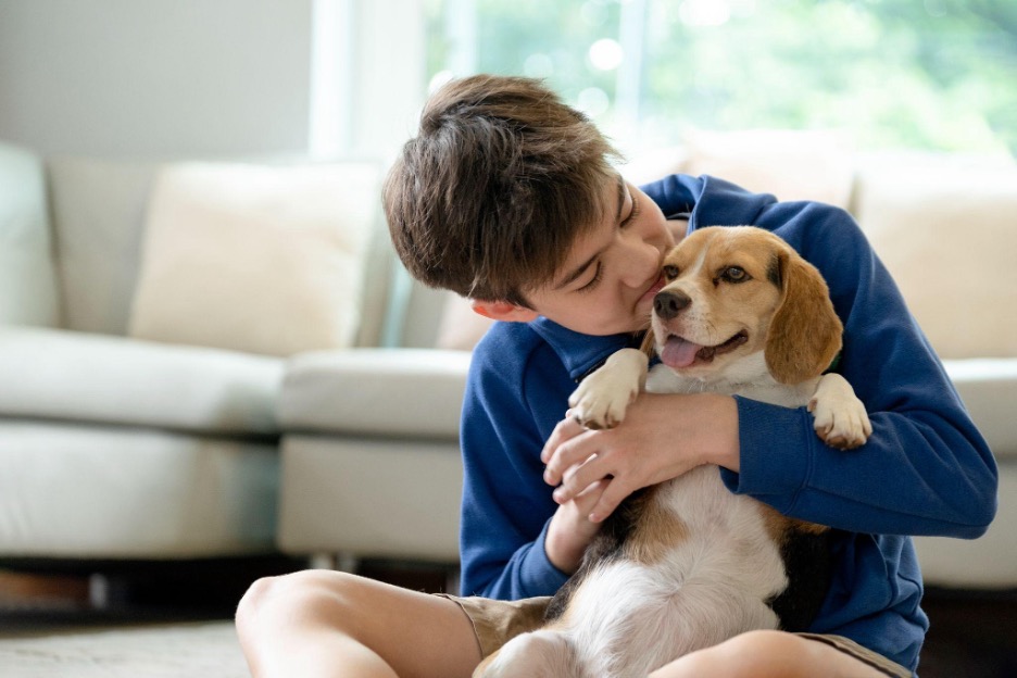 Man Hugging Dog